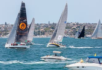 Watch the Boxing Day race yachts glide swiftly by the vessel and into the open sea