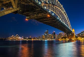 Views of the illuminated Sydney Harbour Bridge from the Magistic Dinner Cruise