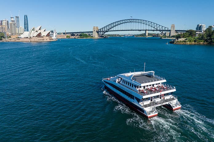 An aerial view of the Magistic cruising towards the harbour attractions on Sydney Harbour.