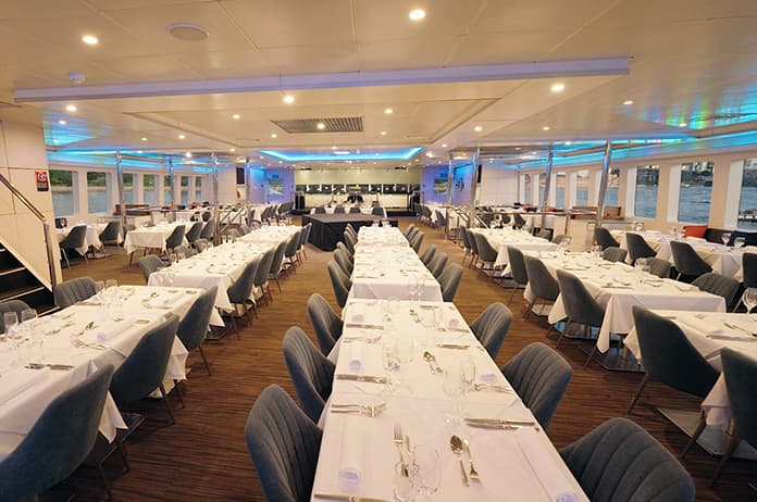A spacious dining saloon with reserved seats on the Magistic cruises.