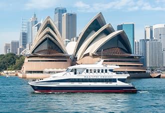 Stunning view of the Magistic Lunch Cruise gliding past the iconic Opera House