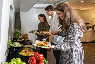 Guests enjoying the unlimited multi-cuisine buffet on Magistic lunch cruise.