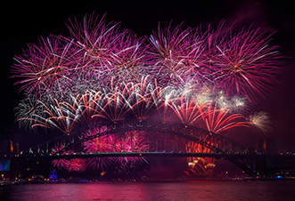 View of Colurful Sydney NYE fireworks bursting into the skies from Magistic NYE cruise