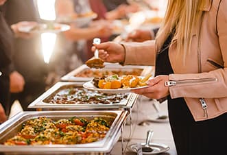 Guests serving multi-cuisine Christmas buffet menu aboard the Magistic Christmas Day cruise