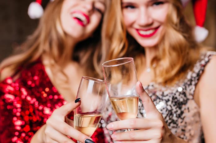 Guests enjoying Christmas party dinner and drinks on Magistic Christmas party cruise